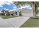 Lovely single-Gathering house displaying a two-car garage, complemented by a sprawling driveway and verdant lawn at 19540 Glen Elm Way, Orlando, FL 32833