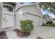 Attached two-car garage providing ample parking and storage, adjacent to the inviting front entrance at 19540 Glen Elm Way, Orlando, FL 32833
