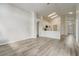Open floor plan features a spacious living room and a modern kitchen with laminate flooring throughout at 19540 Glen Elm Way, Orlando, FL 32833