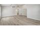 Open-concept living room with contemporary flooring, neutral paint, and archways creating a sense of flow at 19540 Glen Elm Way, Orlando, FL 32833