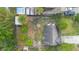Aerial view of property showing backyard with shed, palm tree, and lawn relative to the house at 2123 Weber St, Orlando, FL 32803