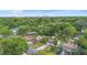 Aerial view capturing the home's placement among lush greenery, showcasing a serene and private residential setting at 2123 Weber St, Orlando, FL 32803