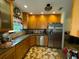 Bright kitchen featuring wooden cabinetry, stainless steel appliances, and lots of natural light at 2123 Weber St, Orlando, FL 32803