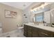Elegant bathroom with marble countertop, modern lighting, stylish fixtures, and relaxing ambiance at 2447 Hassonite St, Kissimmee, FL 34744