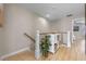 Upstairs hallway with hardwood floors, decorative shelving, a plant and natural light at 2447 Hassonite St, Kissimmee, FL 34744