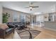 Expansive living room showcasing hardwood floors, contemporary furnishings, and open layout at 2447 Hassonite St, Kissimmee, FL 34744