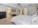 Serene main bedroom with light, open layout, neutral tones, ensuite bathroom, and ample closet space at 2447 Hassonite St, Kissimmee, FL 34744