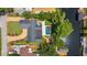 Birds eye view of a home featuring a backyard pool, lush landscaping, and a canal at 2491 Island Dr, Longwood, FL 32779