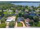 Aerial view of a home with a pool and canal access, showing its location near the lake at 2491 Island Dr, Longwood, FL 32779