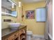 Bright bathroom with a unique vessel sink, wooden vanity, and a window at 2491 Island Dr, Longwood, FL 32779