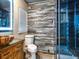 Stylish bathroom features wood-look tile, a modern glass shower, and a unique vessel sink on a rustic wood vanity at 2491 Island Dr, Longwood, FL 32779