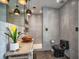 Modern bathroom featuring gray tile, pendant lights, a unique sink, and a sleek black toilet at 2491 Island Dr, Longwood, FL 32779