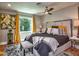 Bedroom showcasing modern decor, a large window with decorative curtains, and soft lighting at 2491 Island Dr, Longwood, FL 32779