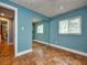 Bedroom showing a large mirrored closet, hardwood floors, and a window at 2491 Island Dr, Longwood, FL 32779