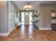 Inviting foyer with hardwood floors, ample natural light and decorative touches at 2491 Island Dr, Longwood, FL 32779
