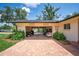 Open garage with brick-paved driveway, with ample space for storage and vehicles at 2491 Island Dr, Longwood, FL 32779