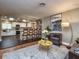 Stylish open floorplan featuring an adjacent Kitchen, stone fireplace, and modern decor at 2491 Island Dr, Longwood, FL 32779