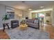 Cozy living room with a stone fireplace, stylish furnishings and an open floor plan at 2491 Island Dr, Longwood, FL 32779