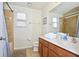 Bathroom with tile shower and vanity with sink and countertop space at 2660 Santosh Cv, Kissimmee, FL 34746