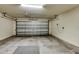 Spacious garage with ample room for parking and storage, featuring a functional garage door at 2660 Santosh Cv, Kissimmee, FL 34746