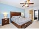 Large main bedroom with an ensuite bathroom and stylish decor at 2660 Santosh Cv, Kissimmee, FL 34746