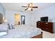 Spacious main bedroom with an ensuite bathroom and a large dresser at 2660 Santosh Cv, Kissimmee, FL 34746