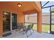 The screened-in patio has comfortable seating and provides an inviting outdoor living space at 2660 Santosh Cv, Kissimmee, FL 34746