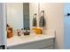 Bathroom featuring a white vanity with matte black hardware and decorative accents for a clean, modern aesthetic at 2841 Willowseed Ln, St Cloud, FL 34772