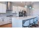 Bright kitchen with stainless steel appliances, gas cooktop, and center island with bar seating at 2841 Willowseed Ln, St Cloud, FL 34772