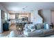 Open-concept living room and kitchen, perfect for entertaining and Gathering time at 2841 Willowseed Ln, St Cloud, FL 34772