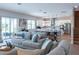Spacious living area with an open floorplan connects seamlessly to the kitchen and outdoor patio at 2841 Willowseed Ln, St Cloud, FL 34772
