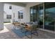 Inviting outdoor patio with wicker furniture and blue accents, perfect for relaxing and entertaining at 2841 Willowseed Ln, St Cloud, FL 34772
