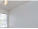 Bright bedroom featuring a neutral color palette, ceiling fan, and a window allowing natural light to fill the space at 2903 Joseph Cir, Oviedo, FL 32765