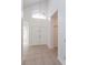Bright foyer featuring tile flooring, a high ceiling, and a double front door at 2903 Joseph Cir, Oviedo, FL 32765