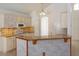 Kitchen featuring granite countertops, a breakfast bar, and white appliances at 2903 Joseph Cir, Oviedo, FL 32765