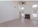 Spacious living area with a fireplace, vaulted ceiling, and tile flooring at 2903 Joseph Cir, Oviedo, FL 32765
