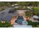 An aerial view showcases the pool, backyard and patio spaces of this beautifully landscaped property at 2918 Wessex St, Orlando, FL 32803