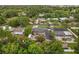 Aerial view of a landscaped property featuring a pool, solar panels, and neighborhood at 2918 Wessex St, Orlando, FL 32803