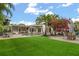 Large backyard featuring a pool, patio, artificial turf, and outdoor dining area, perfect for entertaining at 2918 Wessex St, Orlando, FL 32803