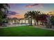 This backyard is perfect for entertaining with a pool, patio, lounge chairs, and green space at 2918 Wessex St, Orlando, FL 32803