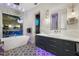 Bathroom featuring a modern tub, vanity, and patterned floor tiles at 2918 Wessex St, Orlando, FL 32803