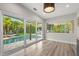 Open dining space with expansive windows overlooking the lush backyard and swimming pool, seamlessly blending indoor and outdoor living at 2918 Wessex St, Orlando, FL 32803