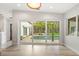Bright dining area with sliding glass doors providing scenic pool views and abundant natural light at 2918 Wessex St, Orlando, FL 32803