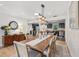 Tastefully decorated dining area featuring a modern light fixture and adjacent kitchen at 2918 Wessex St, Orlando, FL 32803