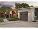 Charming home exterior with well maintained yard, one car garage and cozy front porch sitting area at 2918 Wessex St, Orlando, FL 32803