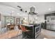 Modern kitchen featuring a spacious island, stainless steel appliances, and an adjacent dining area at 2918 Wessex St, Orlando, FL 32803
