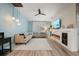 Open living area with modern decor, a sectional sofa, a fireplace, and stylish lighting, creating a welcoming space at 2918 Wessex St, Orlando, FL 32803