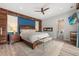 Serene main bedroom with a plush king bed, a cozy fireplace, and convenient en-suite access for ultimate relaxation at 2918 Wessex St, Orlando, FL 32803