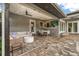 Beautiful outdoor patio with a ceiling fan, dining set, comfortable seating, and seamless access to the home at 2918 Wessex St, Orlando, FL 32803