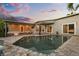 Backyard pool and patio area with ample seating, access to the home's interior, and tropical landscaping at 2918 Wessex St, Orlando, FL 32803